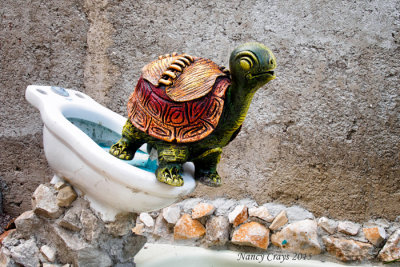 Sculpture of a Turtle on a Seatless Toilet (1195982)