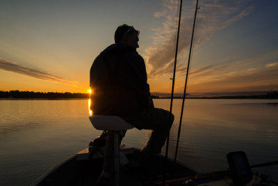 Jonny on his boat at sunrise