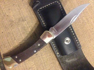 My first folding knife Leather sheath (repurposed saddle bag leather) buck 110 