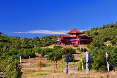 Tara Mandala-Prayer flags lead to temple