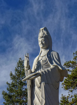 Quan Yin closeup with clouds