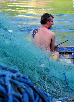 Barra da Lagoa; fisher and nets.