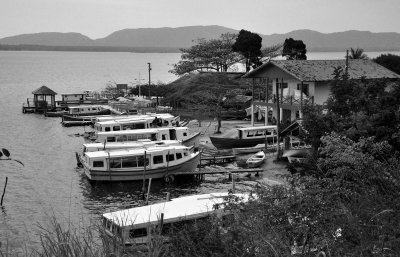 Another view of the boats staying by a restaurant.