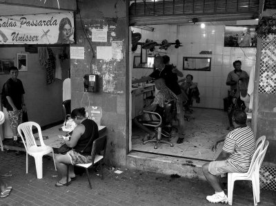 A barber shop, at the favela entrance.