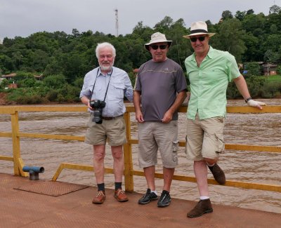 Arnulf, Anísio and Mario, crossing the Rio Uruguai, border Brazil-Argentina, by ferry.