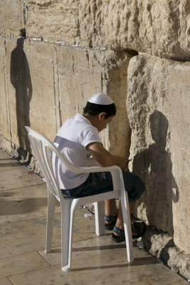 Boy praying at the Western Wall