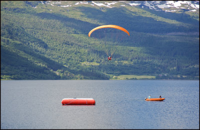 Paraglider landing on raft,Voss...........
