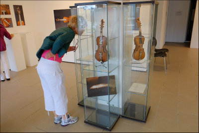 Eva studying a Hardanger fiddle from 1754.......
