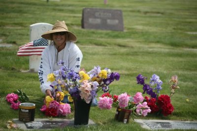  Visiting our lost loved ones. Wife Patty placing flowers on Grand Parents Graves. The flowers were ones that here Granmma loved and grew