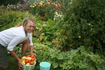 Mother Earth News Wife Patty With our Home Grown Veggies
