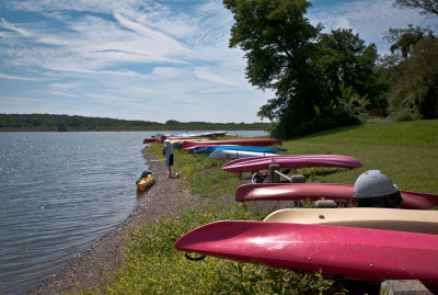 Kayaks on land, sky, and water