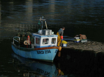 Fishing boat by Eilean Donan Castle