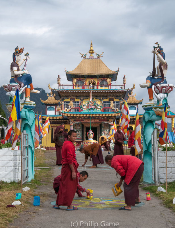Monks at a monastery en route prepare to welcome the Karmapa Lama