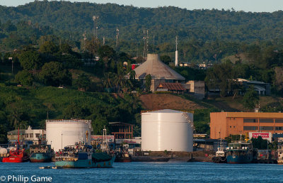 Waterfront storage tanks with the parliament building behind
