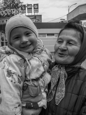 Small siberian in grandma's arms (Russia)