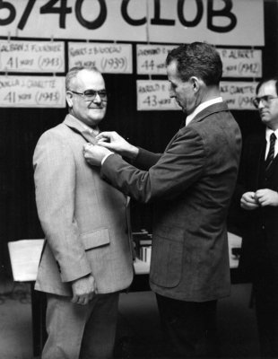 1985 Clifford Desjardins get 40yrs pin from Niall O'Briain 