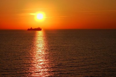 Ships crossing the sun set