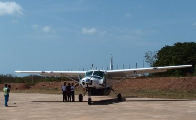 Passenger posing with pilots