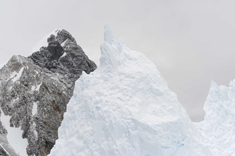 Iceberg with Mountains Behind