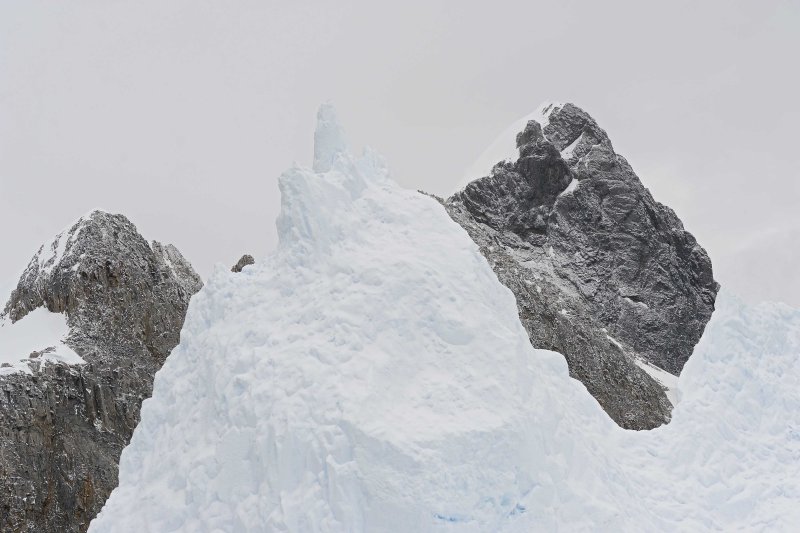 Iceberg against the Mountains