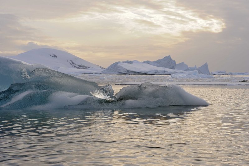 Iceberg with a setting Sun