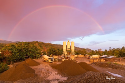 RAINBOW OVER BUED RIVER. A spectacular rainbow appeared at sunset yesterday over the Bued River at Rosario, near the concrete batch plant of Ten-Four Readymix. 
The plant was pouring concrete at TPLEX Phase II when the amazing visual display happened, and I was fortunate to have a camera handy during this rare moment.

Shooting info - Rosario, La Union, Philippines, June 9, 2015, Canon 5D MIII + EF 16-35 f/4 L IS, 16 mm, f/5.6, ISO 320, 1/30 sec, 
manual exposure in available light, hand held, AWB, uncropped full frame resized to 1500 x 1000 pixels.