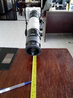 Measuring tape aids in manual focus placement.