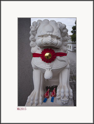 Stone Lioness with Chinese New Year Ornaments