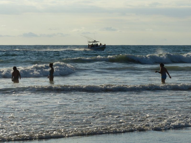 Playing in the waves Playa Sbalo