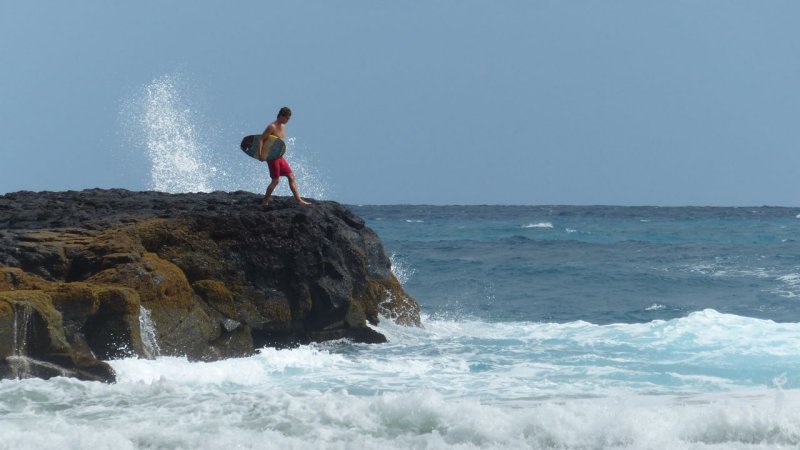 Lumahai Beach Surfer
