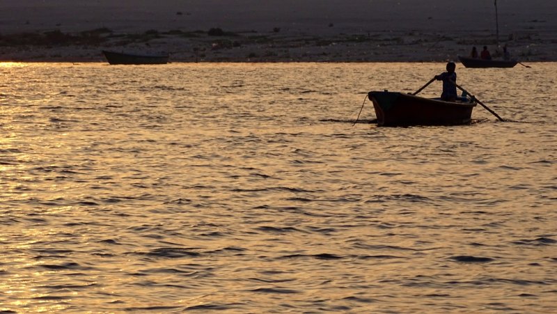 Sunrise Row Across the Ganges River