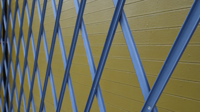 Blue Gate with Yellow Background