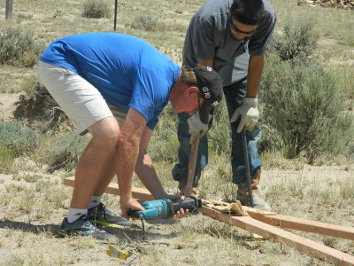 Dr. Sanders and Shawn Happy Deconstructing a truss