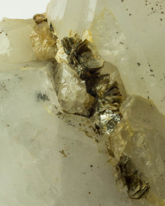 Scheelite crystals to 1 cm with muscovite and quartz. Carrock Mine, Caldbeck Fells.