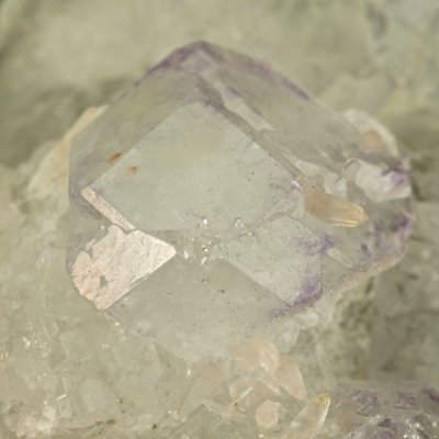 Fluorite spinel twin, 2 cm on 7 cm specimen. Composition plane horizontal. Naica,Chihuahua, Mexico.