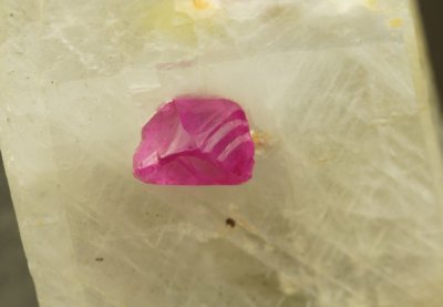 Ruby, transparent trigonal crystal in calcite. 7 mm crystal in 3 cm calcite matrix. Mogok, Burma.