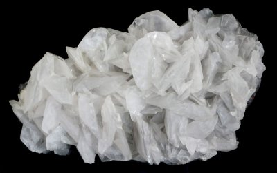 Calcite, 14 cm specimen with rhombohedral crystals to 35 mm. Cambokeels, Weardale.