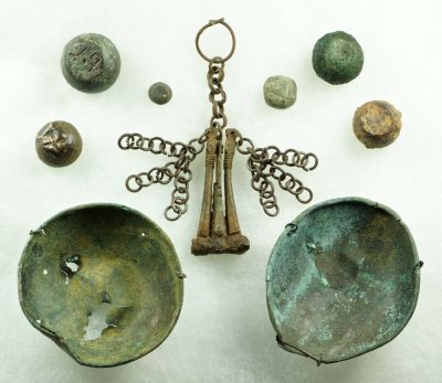 Viking Age scales and spheroid oblate weights, reportedly Ladoga (Aldeigjuborg of Norse sagas) and England (top left).
