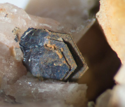 Molybdenite crystals, slightly less than 2 mm on 18 mm matrix. Shap Pink Quarry.