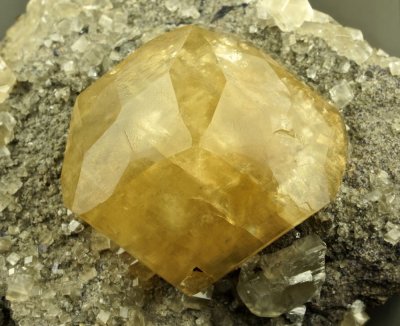 Calcite, complex 45 mm crystal on 11 cm matrix. Berry Materials Quarry, North Vernon, Jennings County, Indiana.