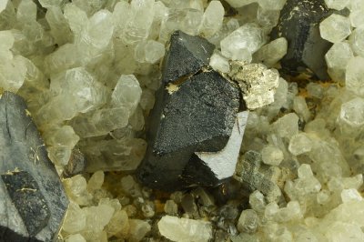 Twinned sphalerite (Fe-rich) to 3cm with pyrite and quartz, 23 cm. 600' level, Wheal Jane Mine, Cornwall. Published specimen.