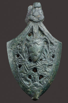Sword chape, copper alloy, 69 mm, Paulsen type B, 10th C. A Borre-style anthropomorphic figure intertwined with a tree. Ukraine.