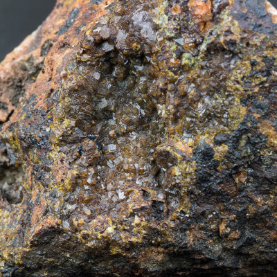 Pharmacosiderite crystals to 1 mm on 5 cm matrix. Burdell Gill, Caldbeck Fells, Cumbria, UK.