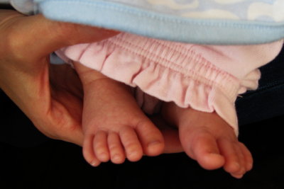 Young Feet - Supporting Hand