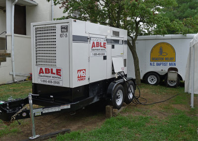 ONE OF THE TWO POWERFUL GENERATORS POWERING MUCH OF THE ON-SITE EQUIPMENT