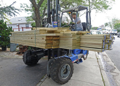 A DELIVERY OF MORE LUMBER FOR THE DECKING