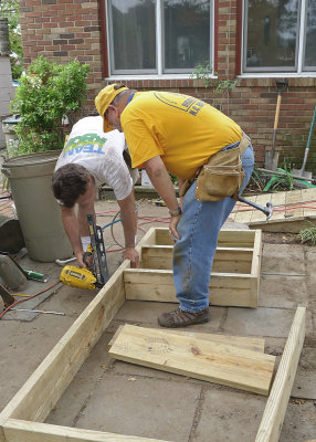 BUILDING A FRAME FOR THE DECK STEPS  -  THE COMPLETED RAMP MAY BE SEEN IN THE BACKGROUND