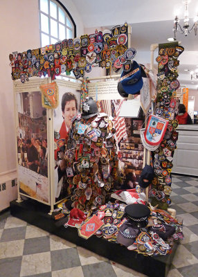 BADGES, HATS, PATCHES AND MEDALS, LEFT BY VISITING LAW ENFORCEMENT AND FIREFIGHTING PERSONNEL FROM ALL OVER THE WORLD