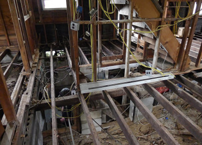 OUR ASSIGNMENT WAS TO SHORE UP SOME SAGGING ROOF SUPPORT AREAS AND STRENGTHEN CRITICAL FLOOR JOISTS