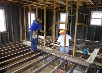 OUR FATHER AND SON TEAM MEMBERS, WORKING HARD TO STRENGTHEN THE FLOOR JOISTS